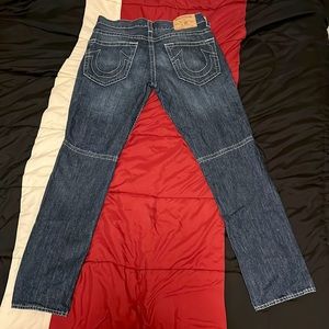 True Religion Blue Jeans with design patterns. Size 33 in waist.